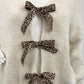 Cardigan Leo-Schleifen beige , Gr. 36-44